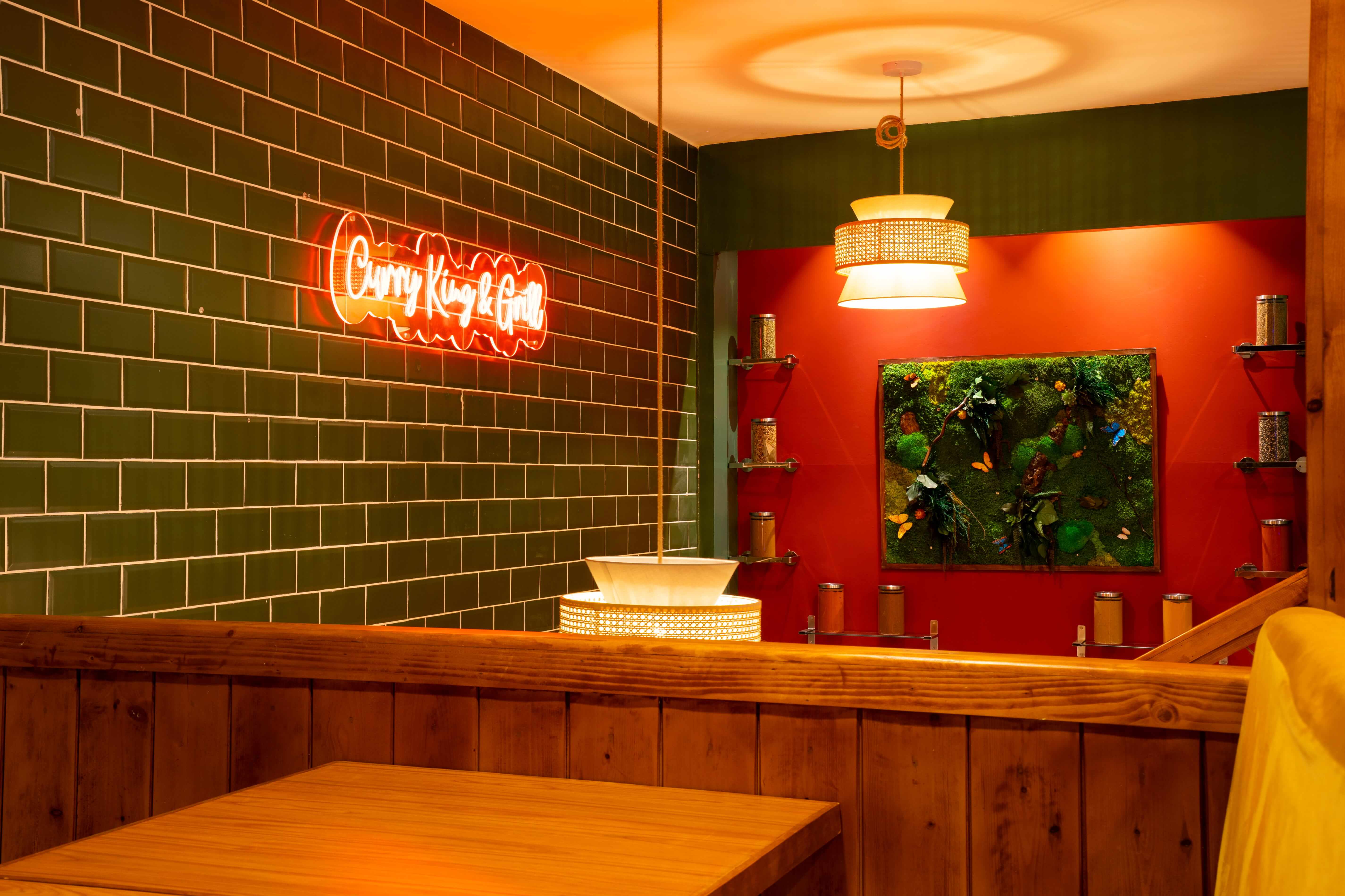 Curry King & Grill interior — neon sign